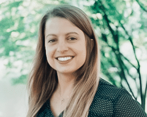 Professional headshot of Britt Fulmer, PCC, CTEDU trainer, smiling outdoors