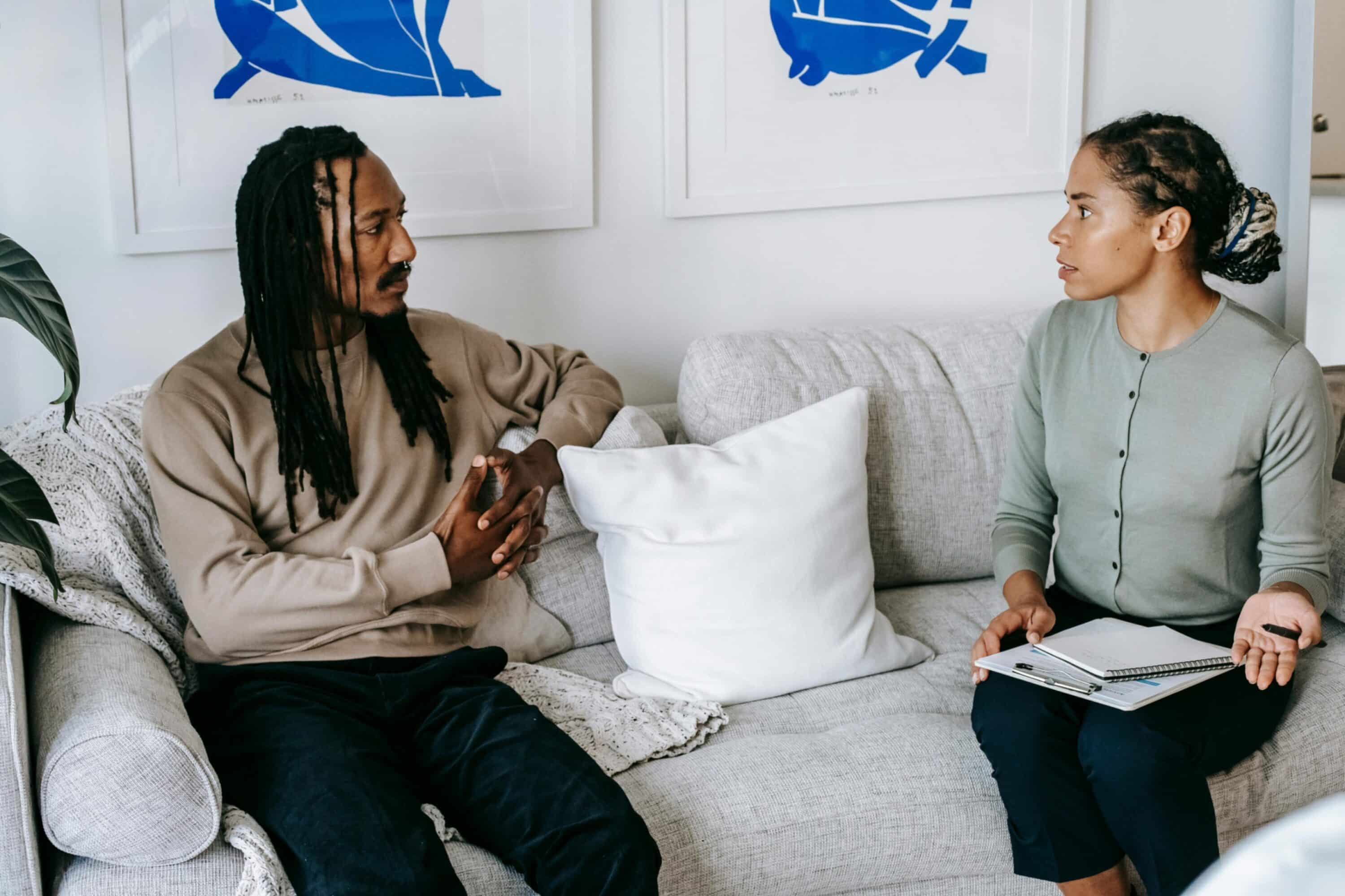 a man and woman having a coaching conversation