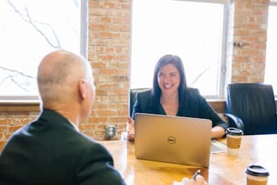 woman and man having a conversation in an office space
