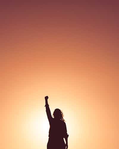 a person holding an arm up hopefully